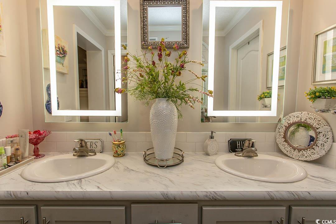 1664 Greenridge Drive Conway, SC 29526 - Photo 31 of 40 Bathroom featuring double vanity, crown molding, a