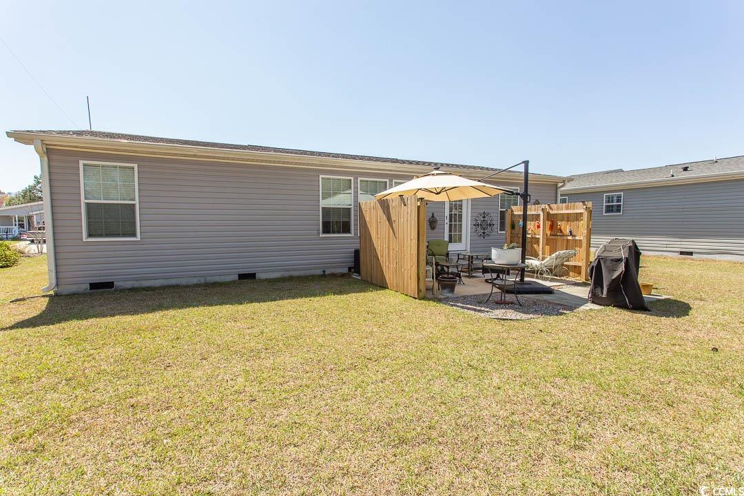 1664 Greenridge Drive Conway, SC 29526 - Photo 39 of 40 Back of property with a lawn, a patio, and crawl s