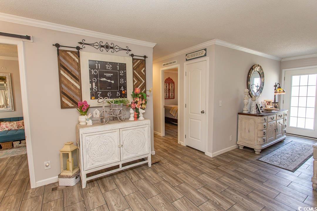 1664 Greenridge Drive Conway, SC 29526 - Photo 4 of 40 Foyer featuring wood finished floors, ornamental m