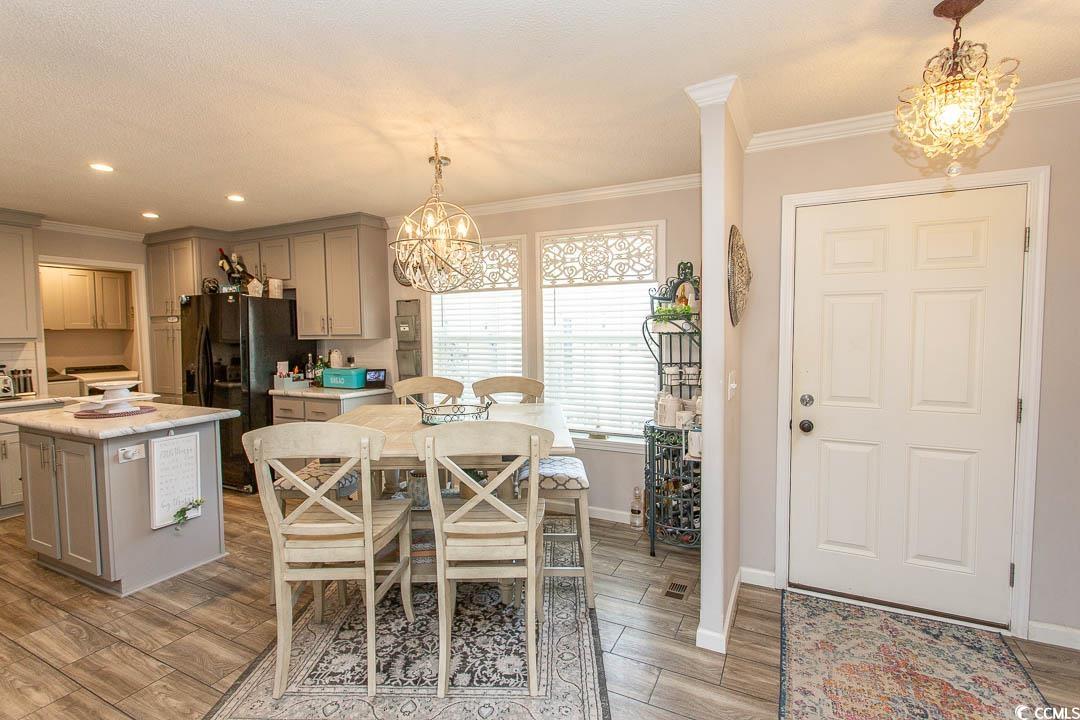 1664 Greenridge Drive Conway, SC 29526 - Photo 5 of 40 Dining space with an inviting chandelier, light wo