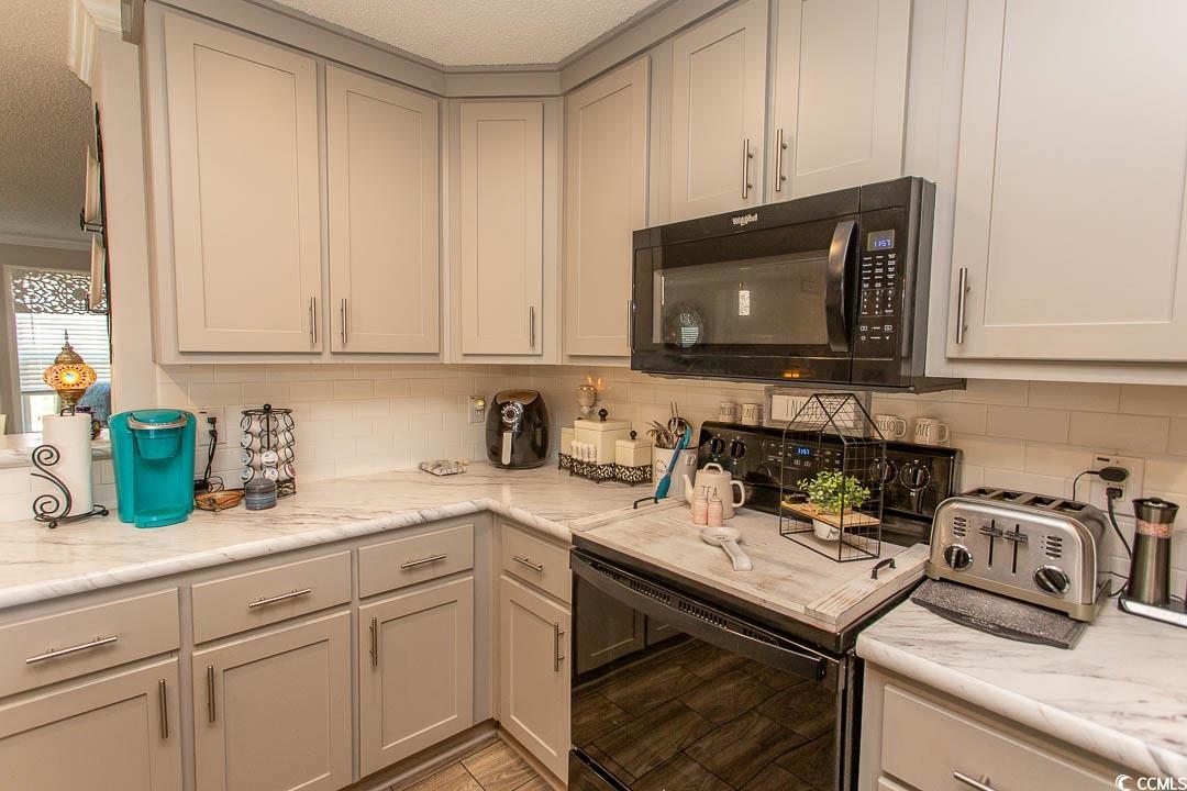 1664 Greenridge Drive Conway, SC 29526 - Photo 9 of 40 Kitchen with a textured ceiling, tasteful backspla