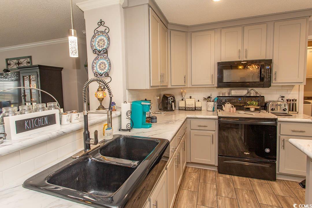 1664 Greenridge Drive Conway, SC 29526 - Photo 10 of 40 Kitchen with a textured ceiling, crown molding, a