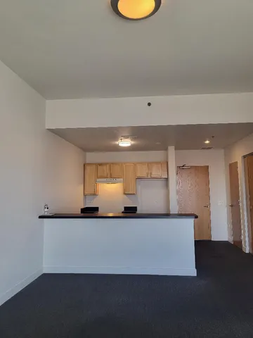 a view of a room with a desk and chair