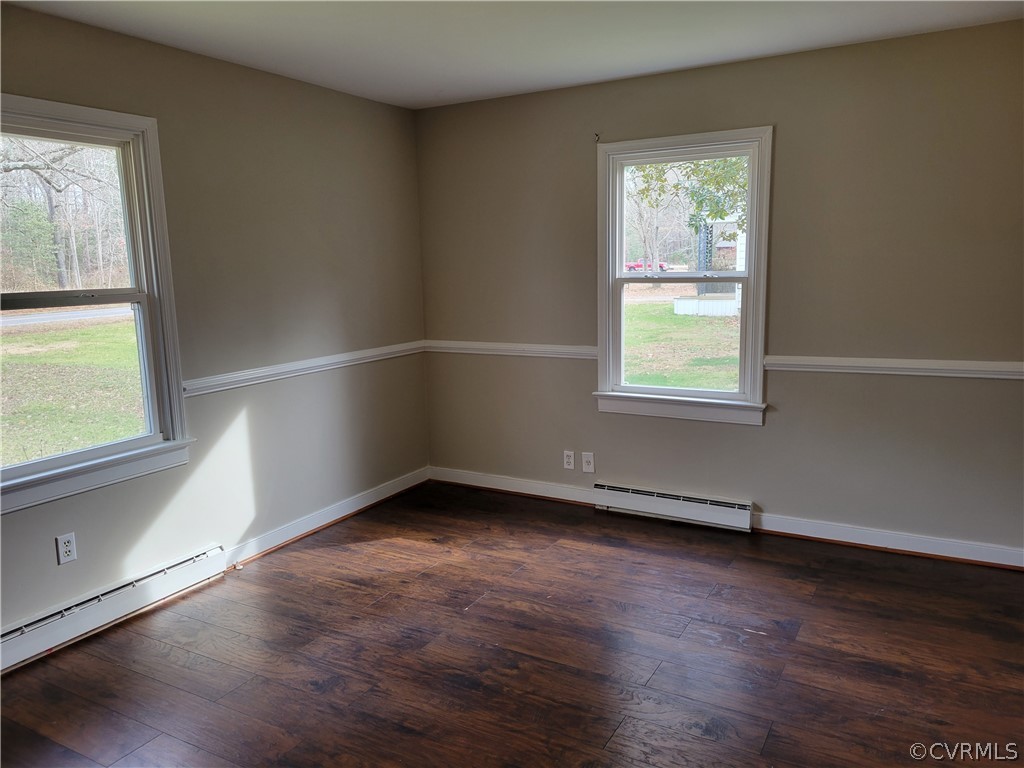 9016 Courthouse Road Chesterfield, VA 23832 - Photo 18 of 20 an empty room with wooden floor and windows