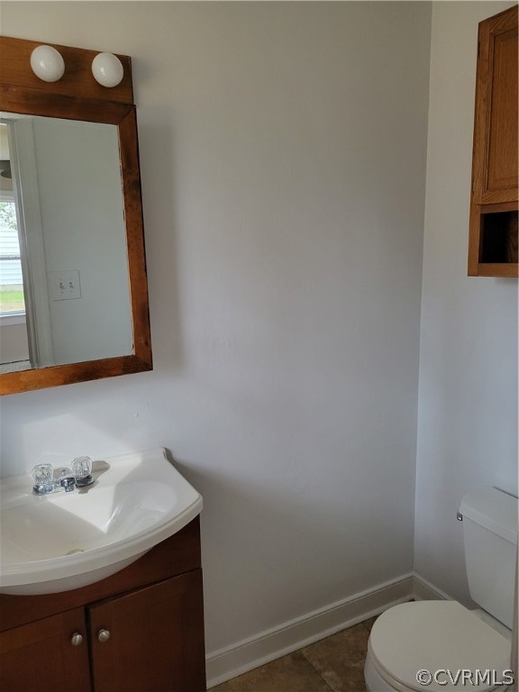 9016 Courthouse Road Chesterfield, VA 23832 - Photo 19 of 20 a bathroom with a toilet sink and mirror