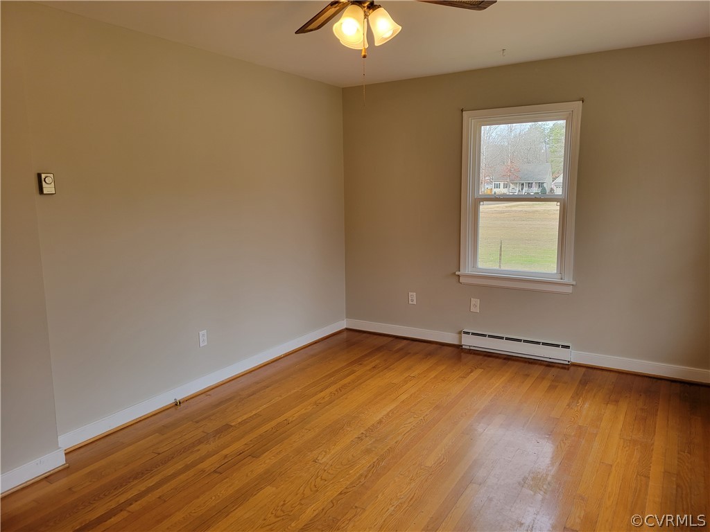 9016 Courthouse Road Chesterfield, VA 23832 - Photo 4 of 20 wooden floor in an empty room with a window