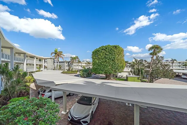 a view of a patio with table and chairs and potted plants