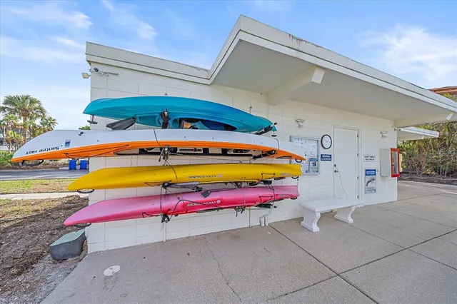 a living room with lots of furniture and a large window