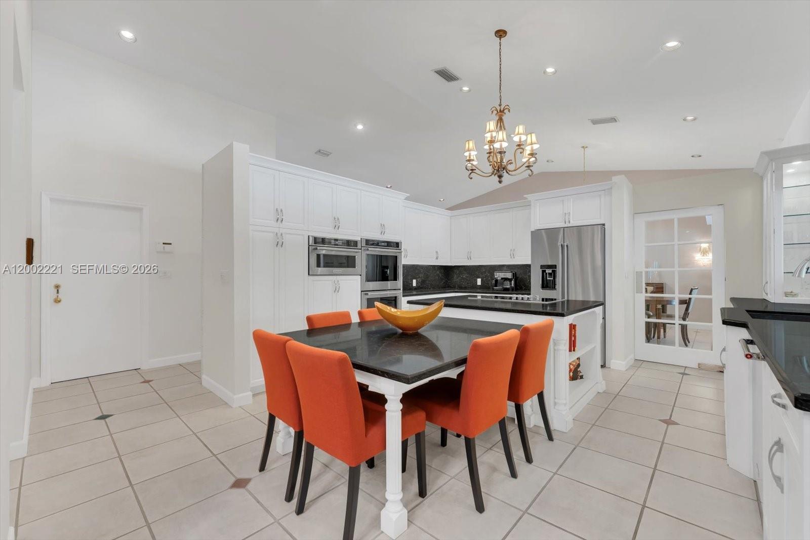9941 Southwest 143rd Street Miami, FL 33176 - Photo 13 of 48 Updated Kitchen with a cooking island, double ovens, KitchenAid appliances