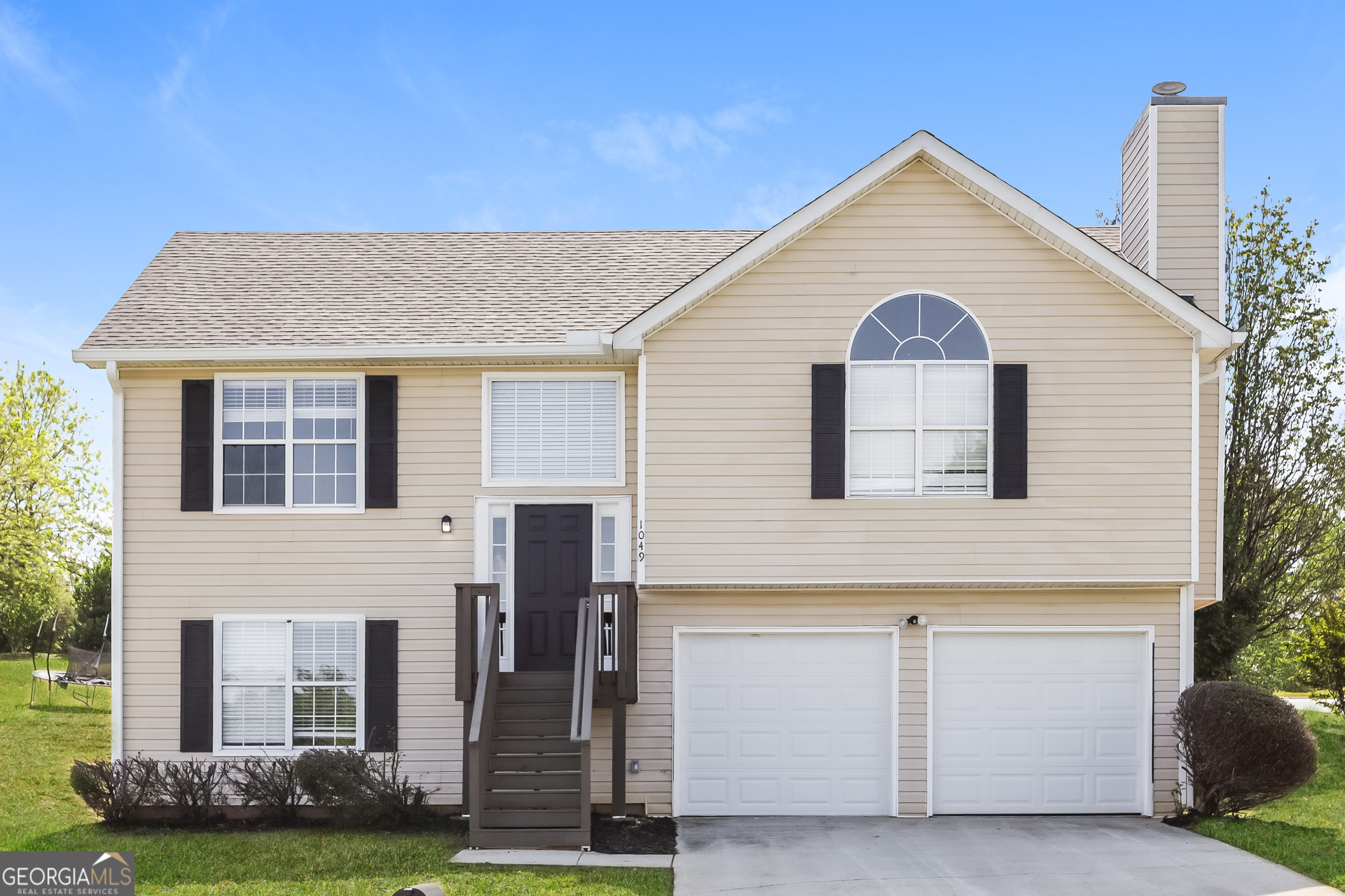 1049 Misty Meadows Lane Hampton, GA 30228 - Photo 1 of 1 a view of a house with a yard