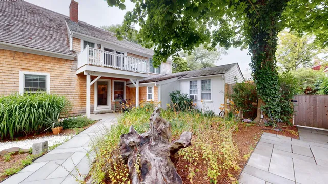 a front view of a house with garden