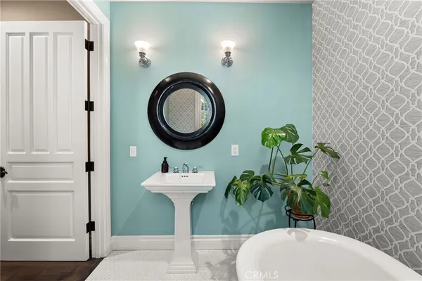 a view of walk in closet with clothes