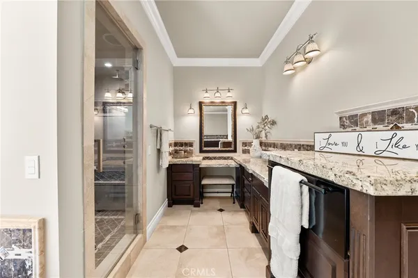 a kitchen with stainless steel appliances granite countertop a stove a sink dishwasher and microwave