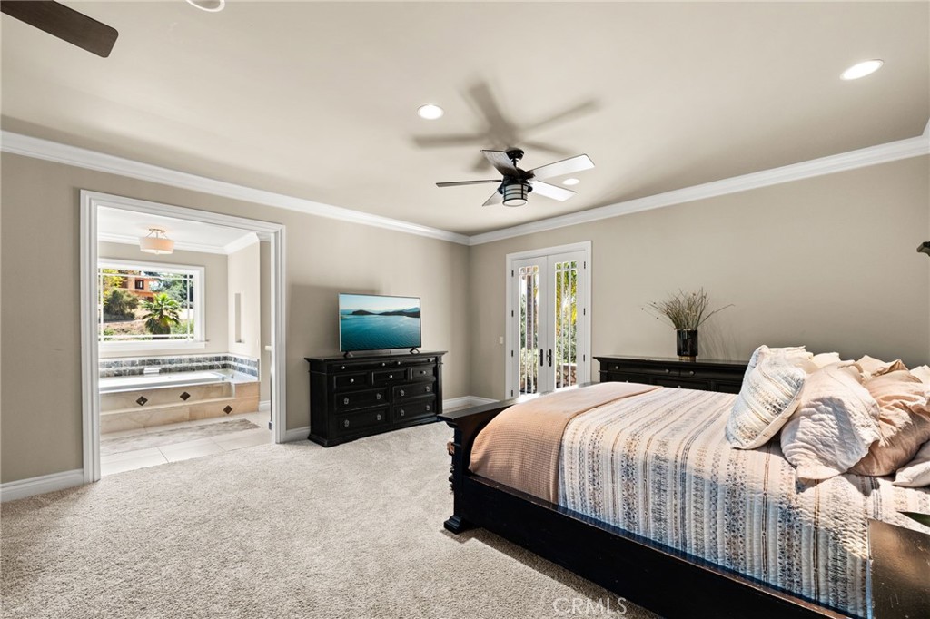 1688 Dwight Street Redlands, CA 92373 - Photo 18 of 72 a bedroom with a bed and a flat screen tv