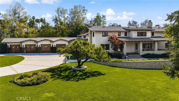 a view of an entryway livingroom and hall with wooden floor