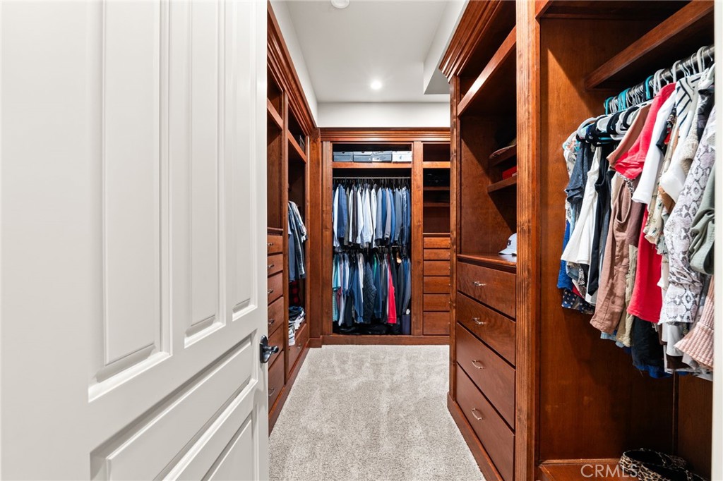1688 Dwight Street Redlands, CA 92373 - Photo 21 of 72 a view of walk in closet with clothes