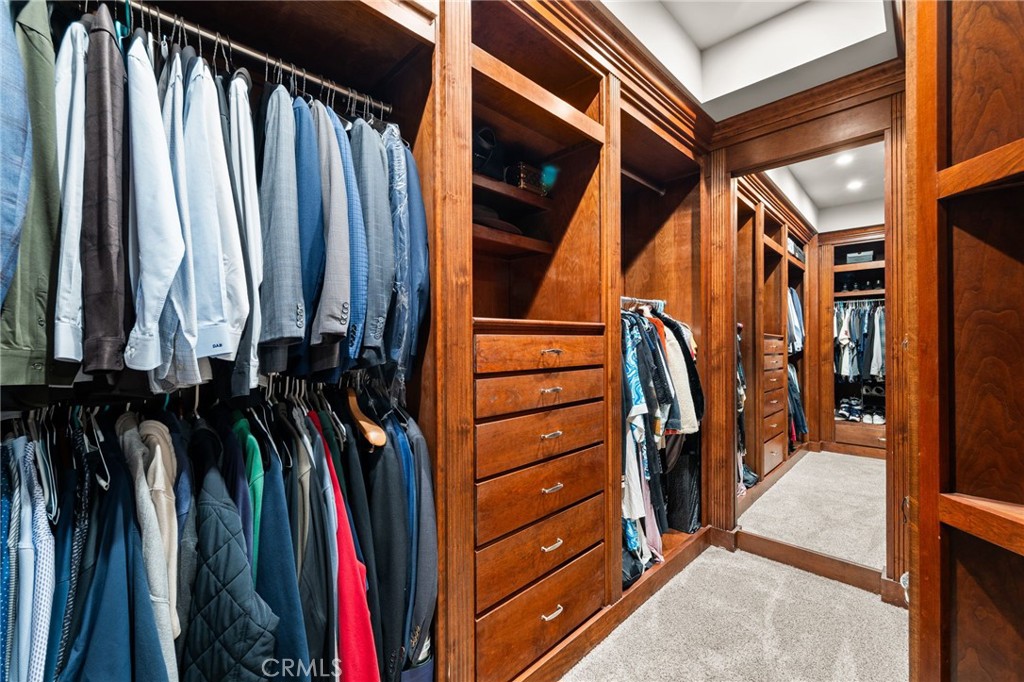 1688 Dwight Street Redlands, CA 92373 - Photo 22 of 72 a view of walk in closet with clothes and shoes