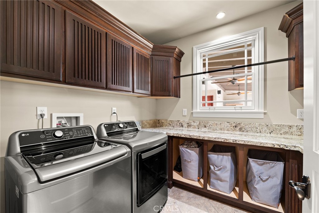 1688 Dwight Street Redlands, CA 92373 - Photo 23 of 72 a kitchen with stainless steel appliances granite countertop a stove a sink dishwasher and microwave