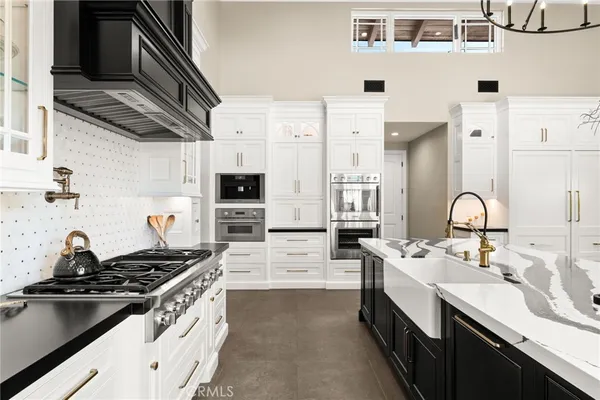 a front view of a house with a table and chairs