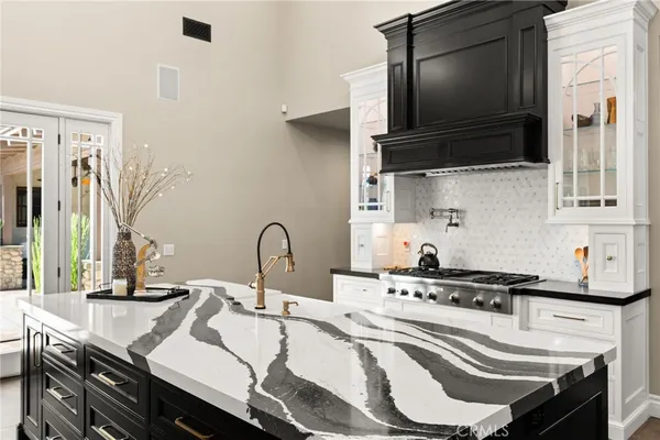 a spacious bedroom with a bed and a fireplace