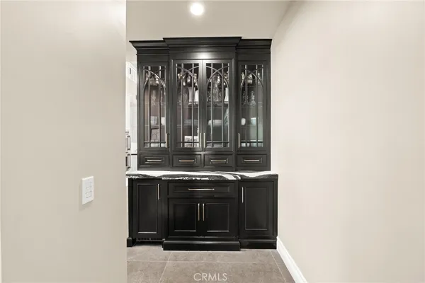 a living room with furniture and large windows