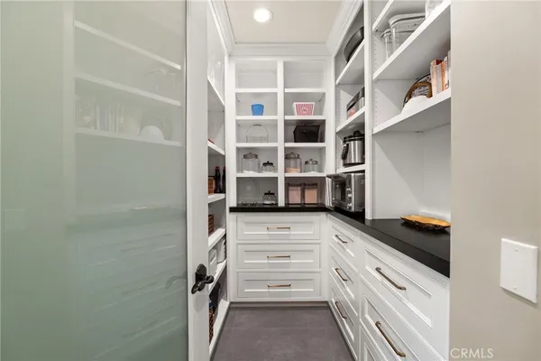 a living room with furniture and a air conditioner vent