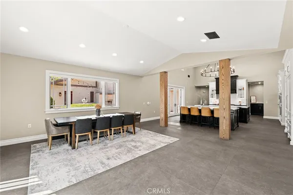 a bathroom with a granite countertop sink mirror vanity and toilet