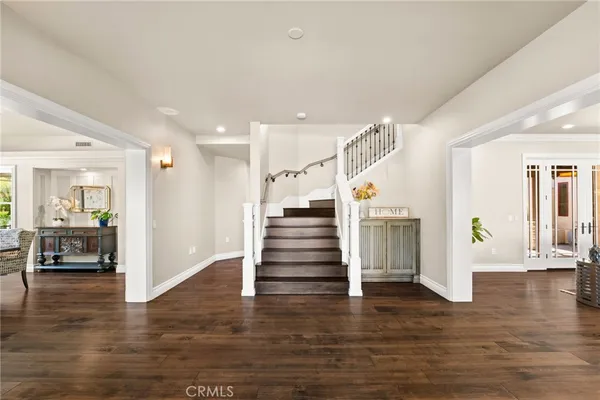 a view of a living room with furniture and fireplace
