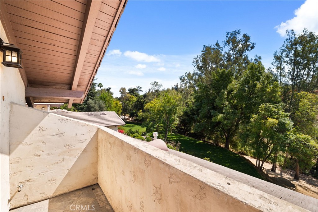 1688 Dwight Street Redlands, CA 92373 - Photo 41 of 72 a view of balcony with wooden floor and fence