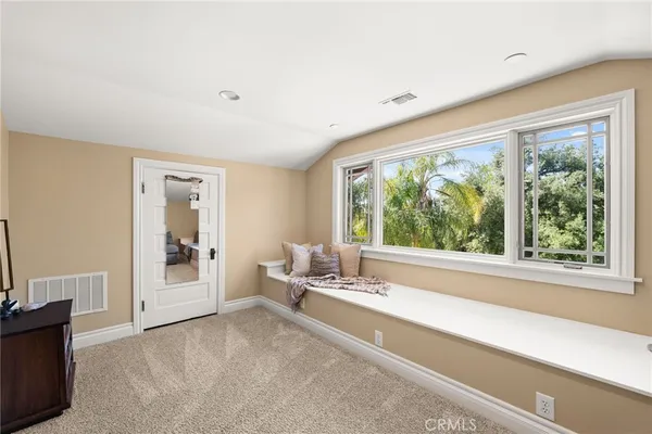 a bathroom with a double vanity sink mirror and toilet