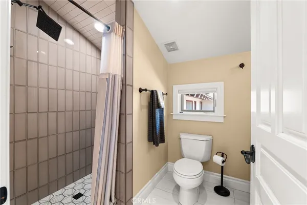 a view of a house with swimming pool and sitting area