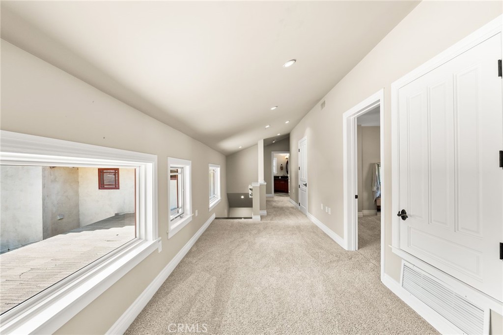 1688 Dwight Street Redlands, CA 92373 - Photo 49 of 72 a view of a hallway with wooden floor and cabinet