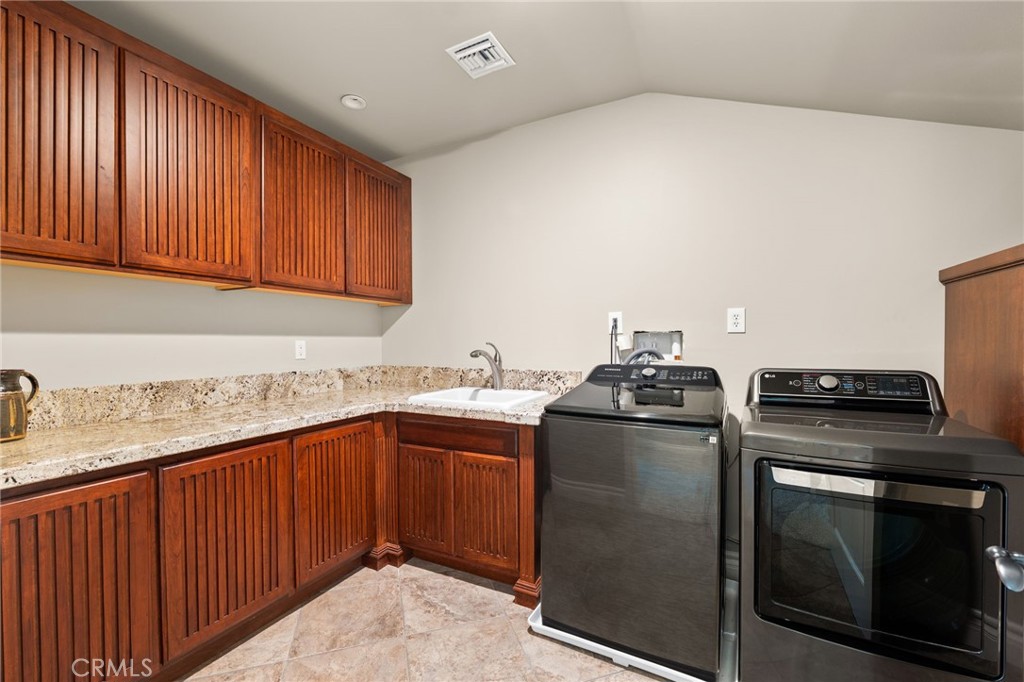 1688 Dwight Street Redlands, CA 92373 - Photo 56 of 72 a kitchen with stainless steel appliances granite countertop a stove and a sink