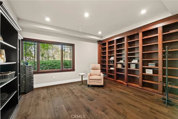 a spacious bathroom with a granite countertop sink and a mirror