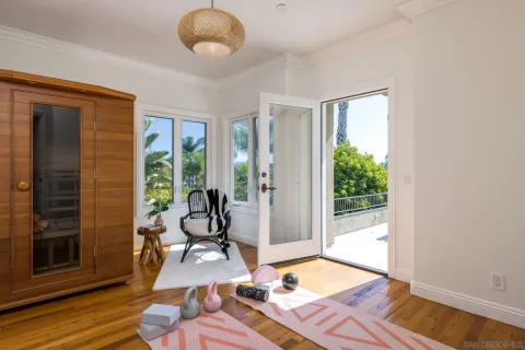 a living room with furniture rug and floor to ceiling window