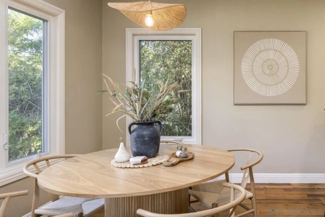 a view of a dining room with furniture window and outside view