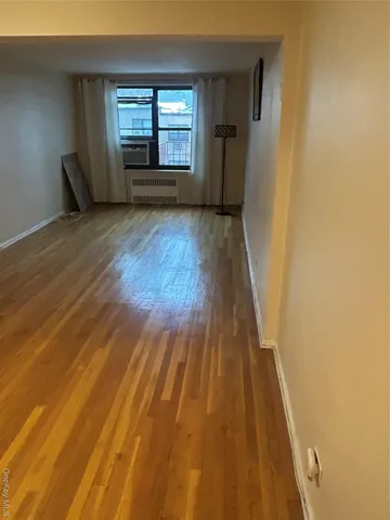 a bathroom with a shower and a sink