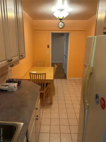 a view of a livingroom with furniture and staircase