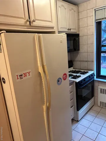 a view of storage and utility room with washer and dryer