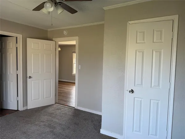 an empty room with closet area