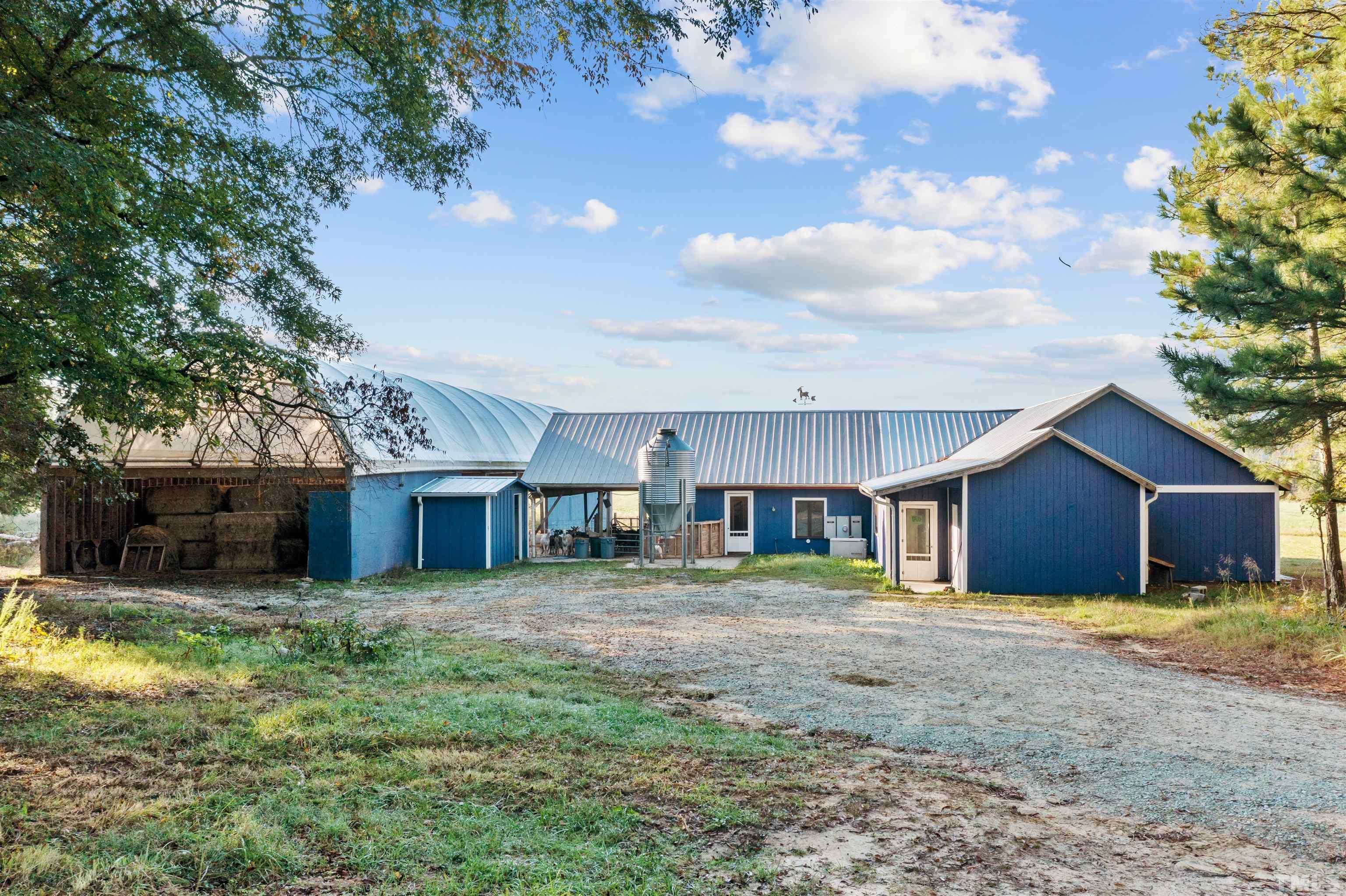 4720 Bahama Road Rougemont, NC 27572 - Photo 19 of 30 a view of a house with a yard