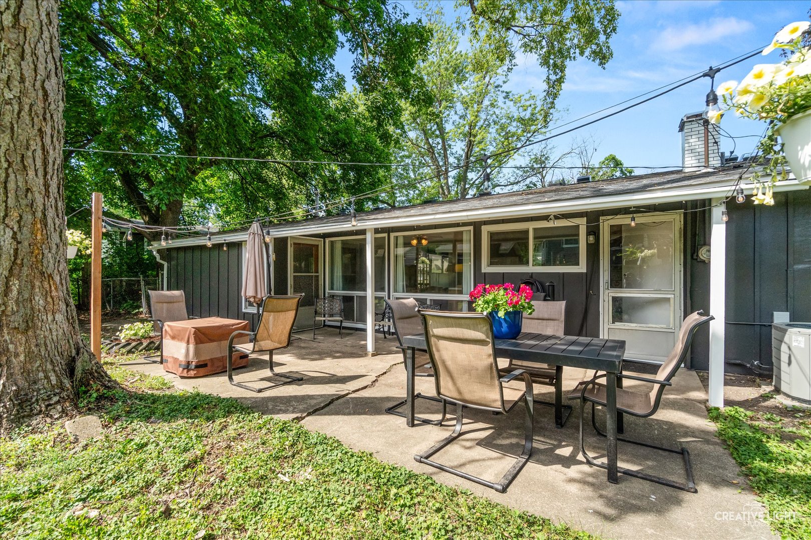 4 Woodcliff Road Montgomery, IL 60538 - Photo 16 of 18 a view of a patio with a table and chairs
