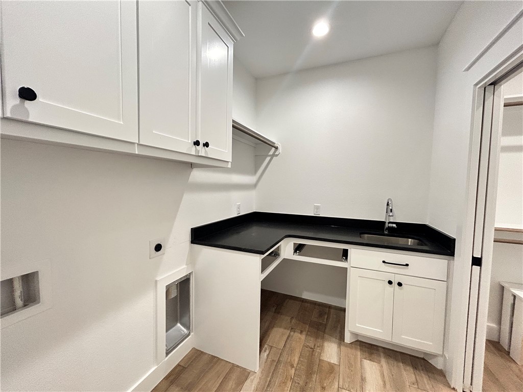 4015 Pacific Crest Way Bryan, TX 77802 - Photo 11 of 22 a kitchen with granite countertop white cabinets and white appliances