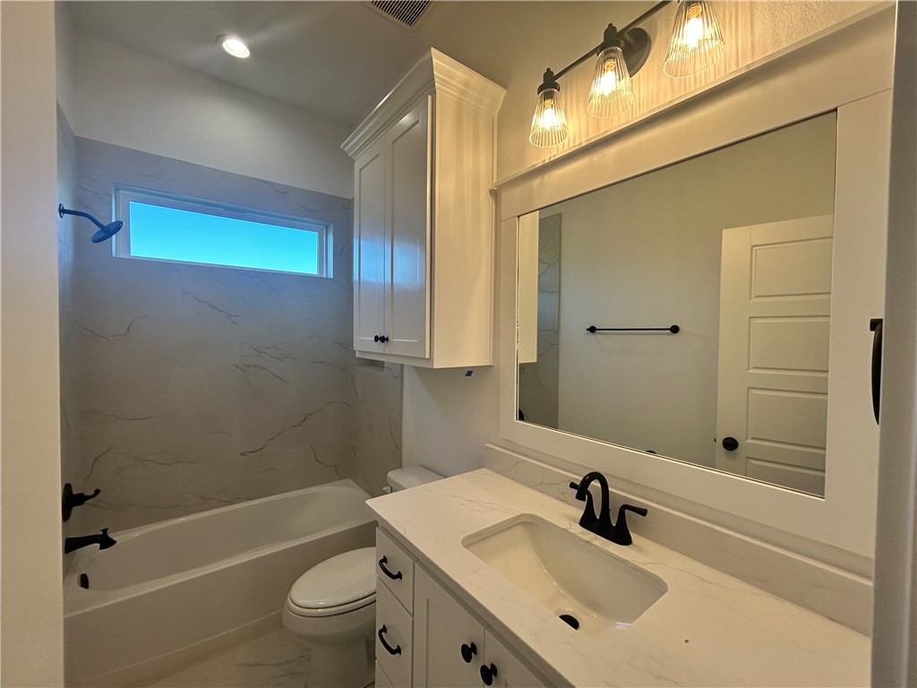 4015 Pacific Crest Way Bryan, TX 77802 - Photo 15 of 22 a bathroom with a sink a toilet and shower