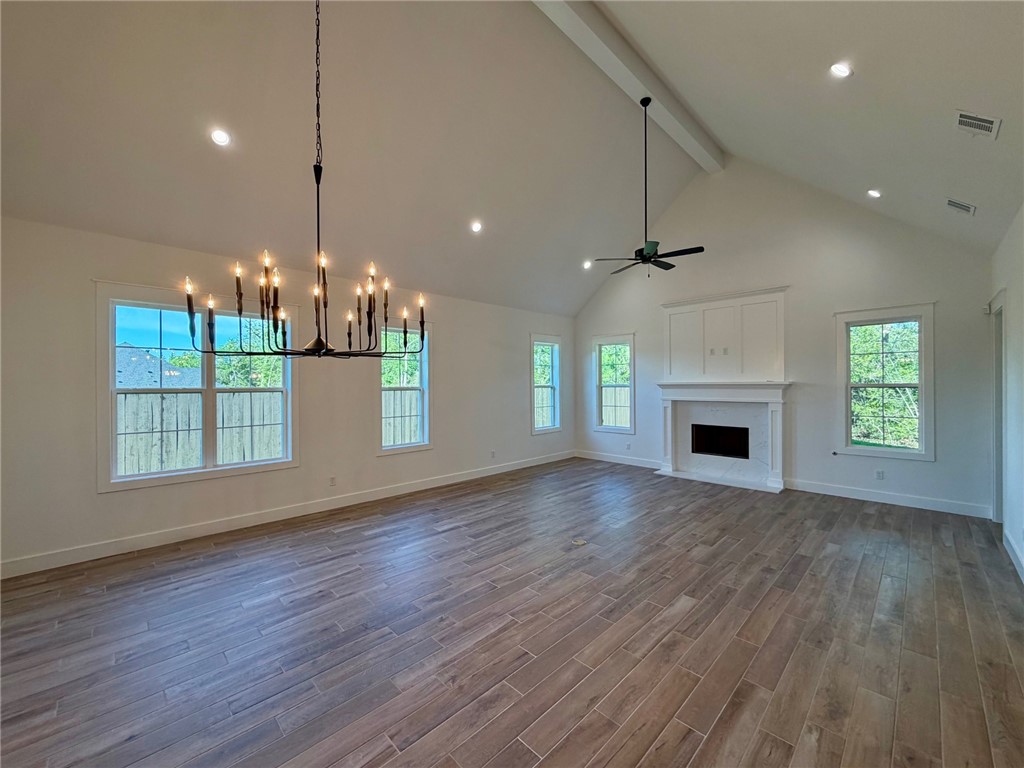 4015 Pacific Crest Way Bryan, TX 77802 - Photo 2 of 22 a view of empty room with wooden floor and fireplace
