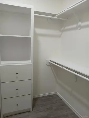 a view of an empty walk in closet