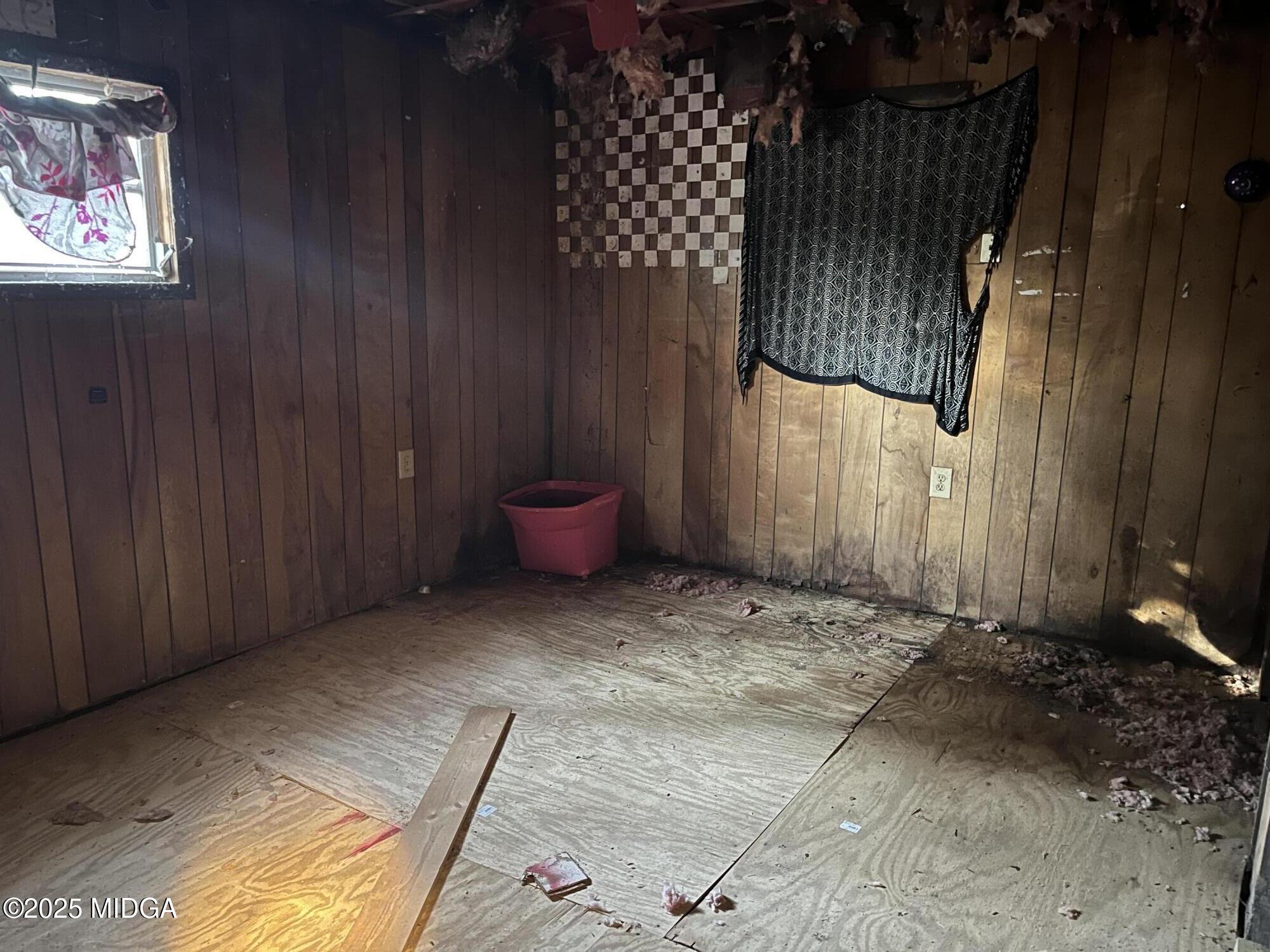 65 Little John Trail Hampton, GA 30228 - Photo 10 of 10 a view of a room with wooden floor and walls