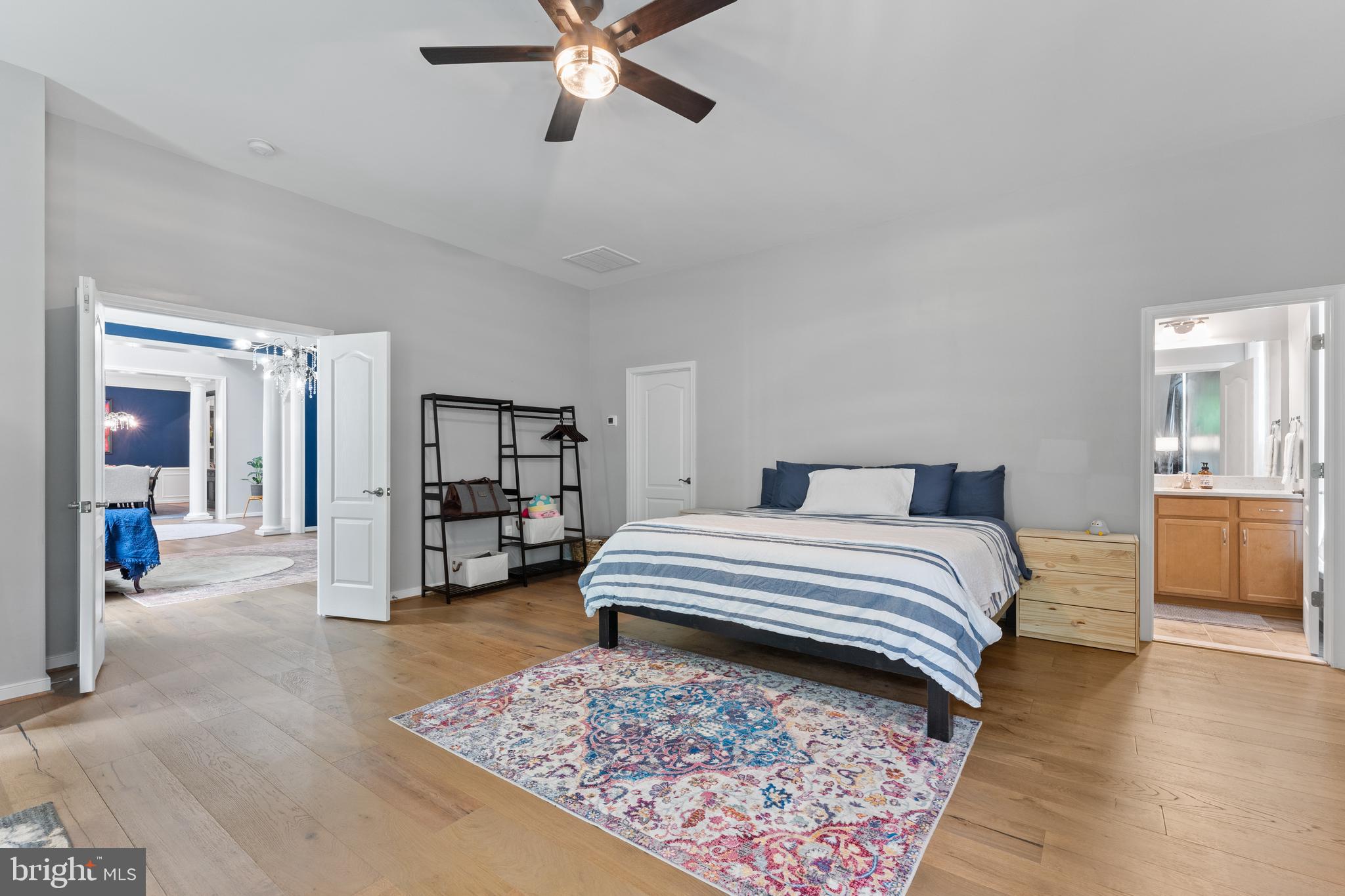 80 Shackelford Well Road Fredericksburg, VA 22406 - Photo 11 of 108 a bedroom with a large bed and a chandelier