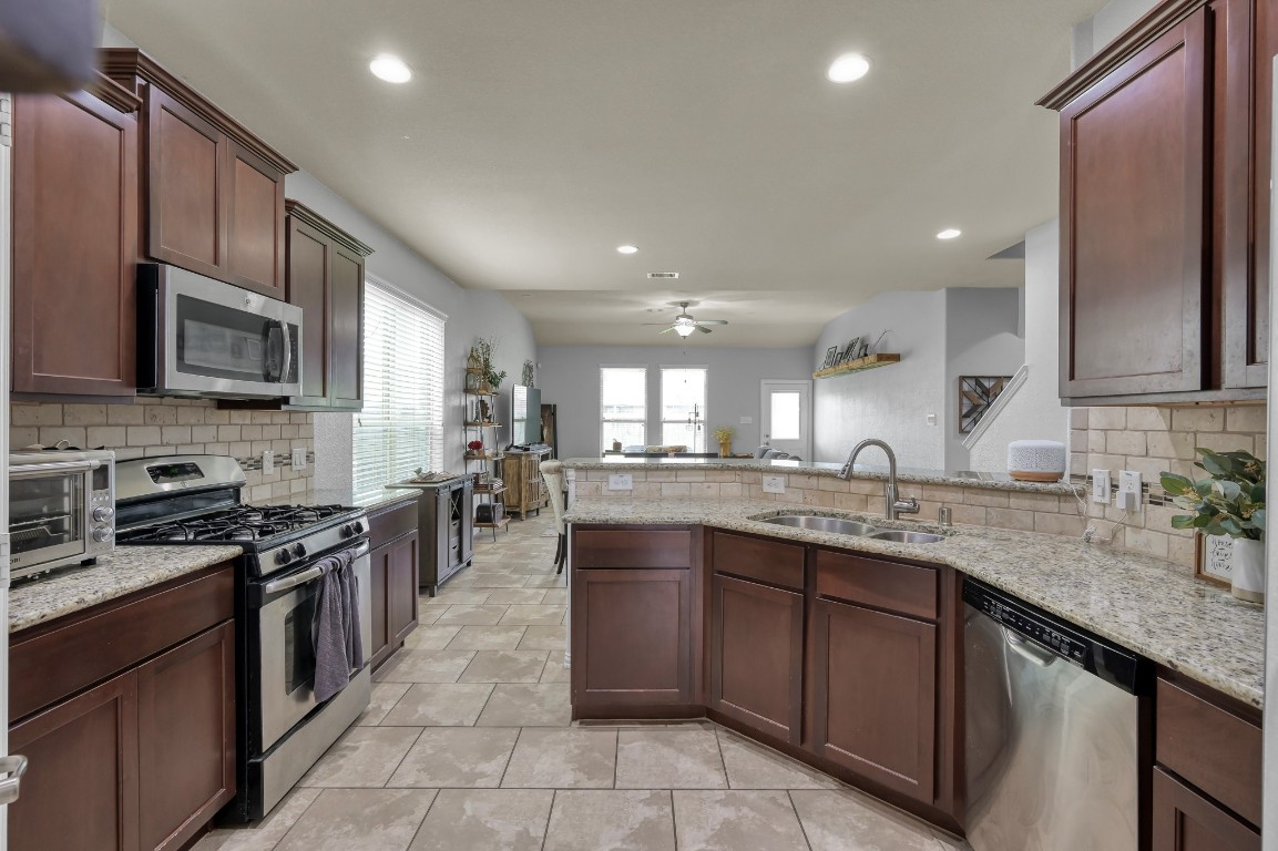 3562 Hamilton Bend Lane Spring, TX 77386 - Photo 3 of 17 The kitchen opens beautifully into the dining and living areas, making it easy to cook dinner, help with homework, and still be part of everything happening at home.