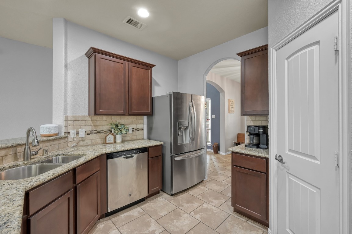 3562 Hamilton Bend Lane Spring, TX 77386 - Photo 4 of 17 This kitchen has the kind of layout that just works for everyday life — open to the living room, full of natural light, and easy for both busy mornings and relaxed evenings.